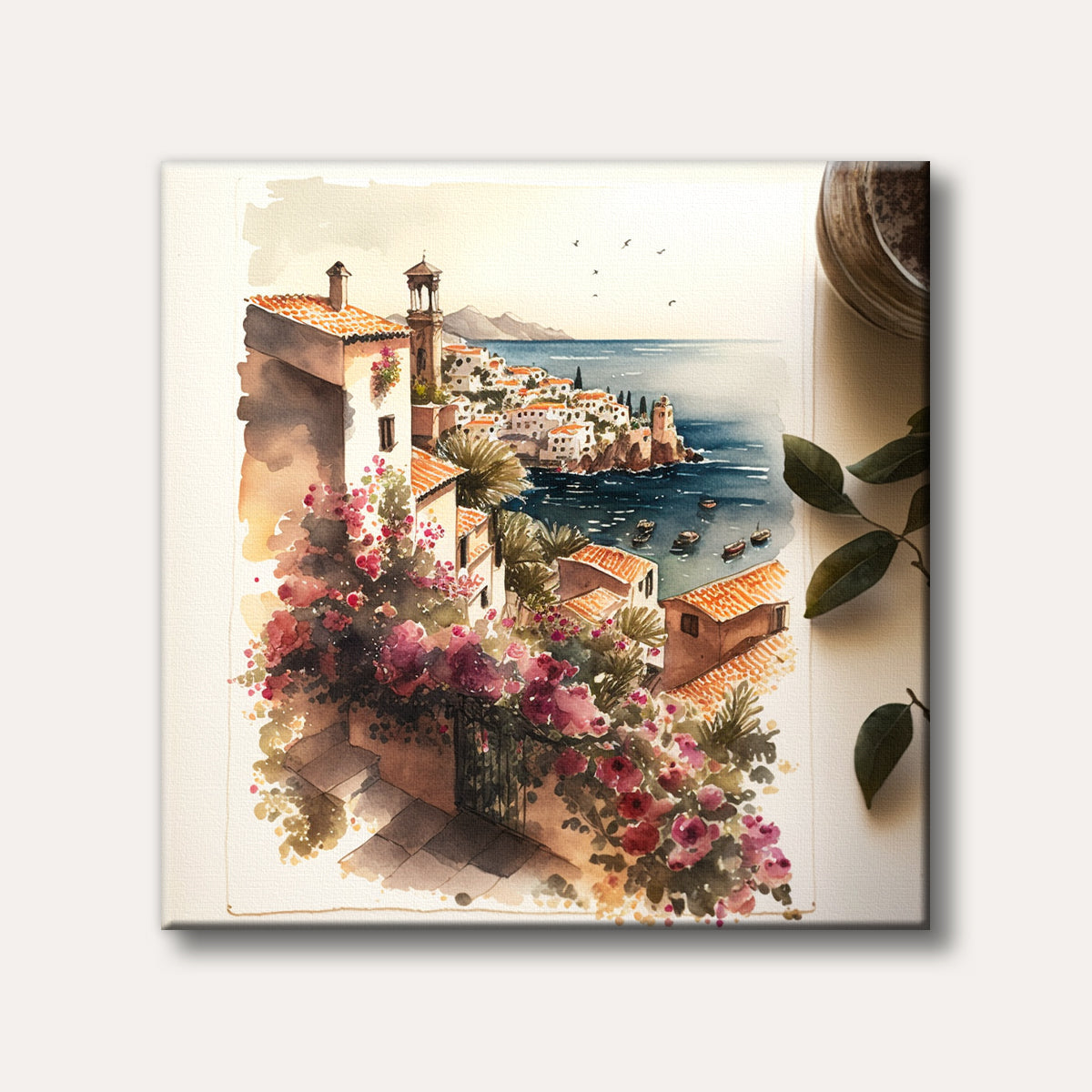 A vibrant watercolour painting illustrates a picturesque Mediterranean coastal town with white buildings, orange roofs, and cascading pink flowers overlooking a deep blue sea with small boats, in a charming and idyllic style.