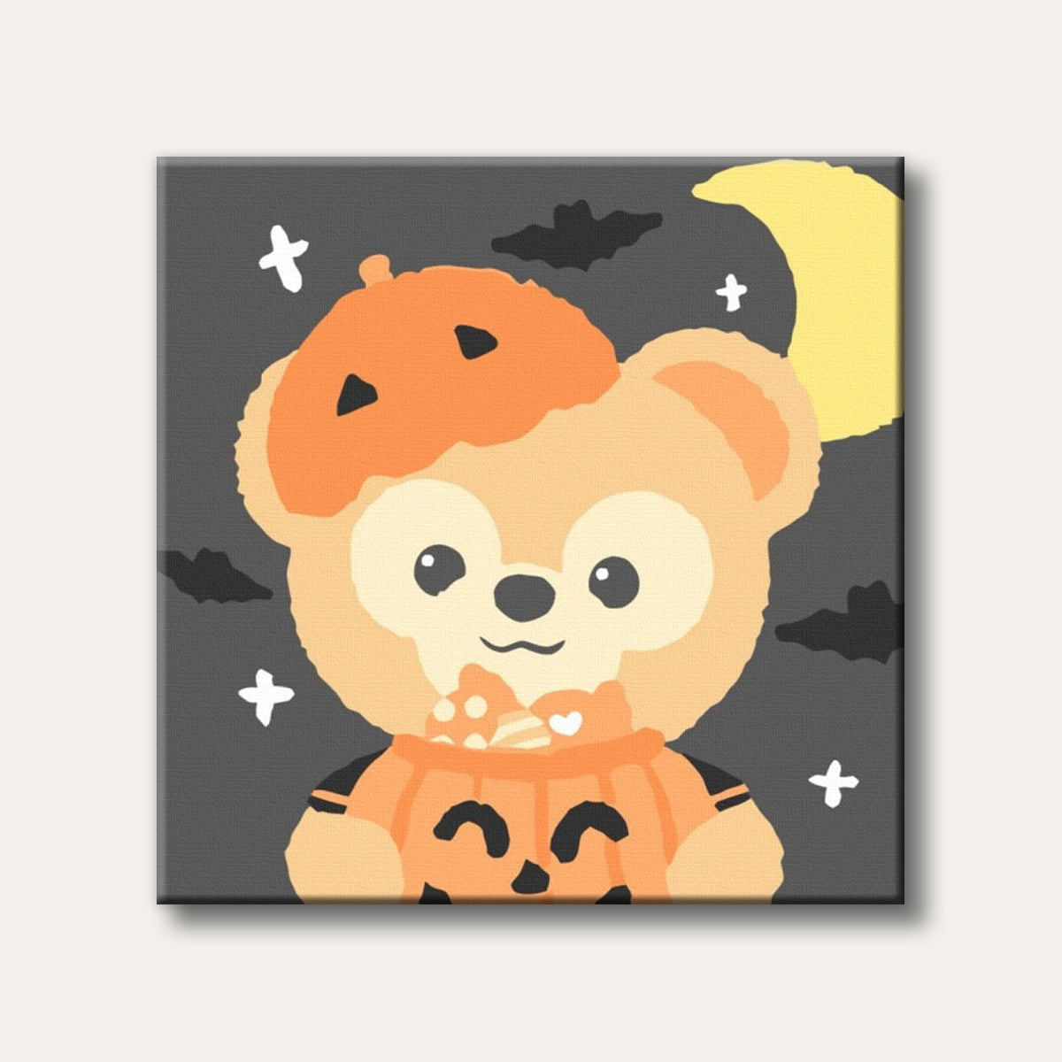 A cute, cartoon-style light brown bear dressed in a pumpkin hat and holding a candy-filled pumpkin bucket, with bats and a crescent moon against a dark Halloween sky.