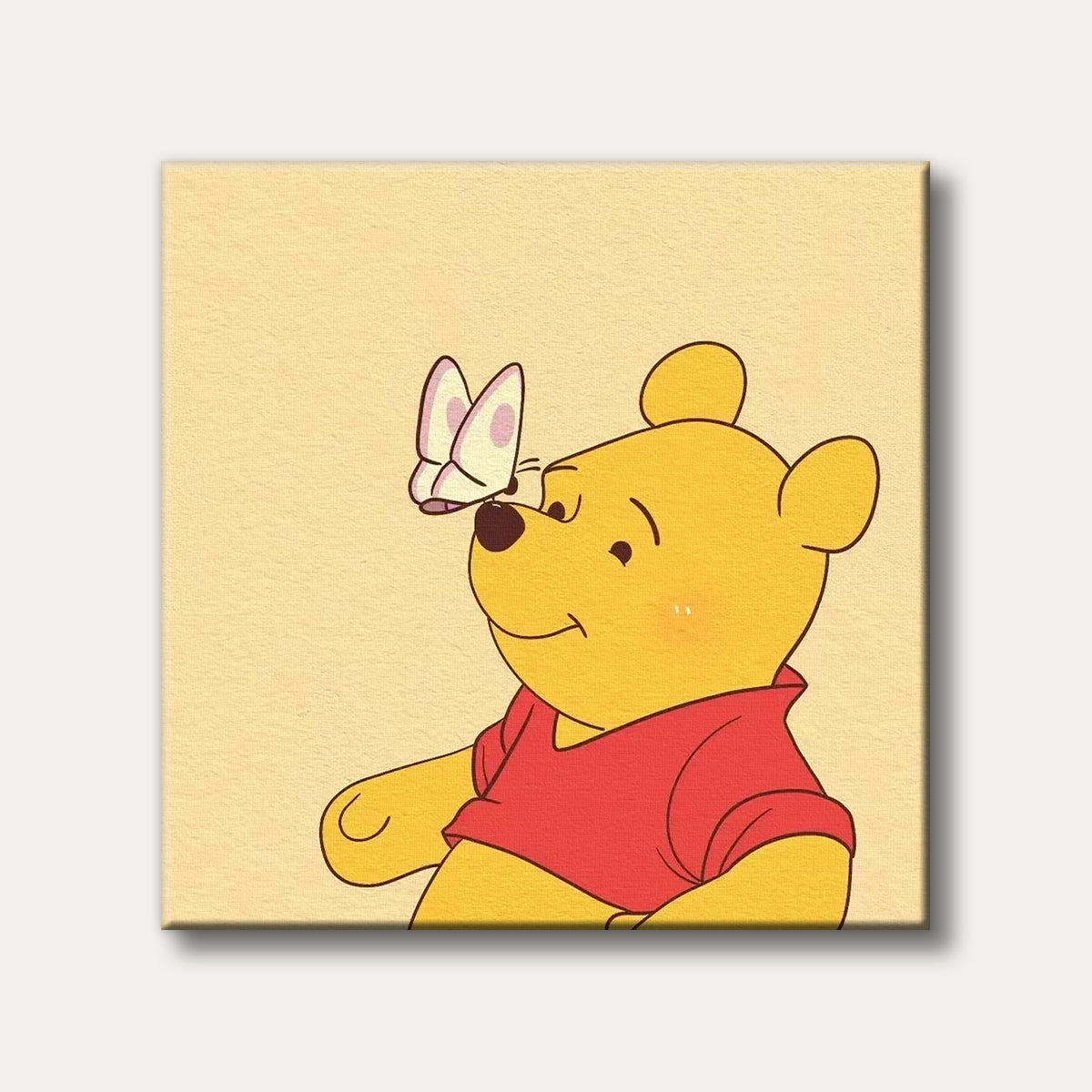 A cheerful Winnie the Pooh character with a light pink and white butterfly perched on his nose, depicted in a simple, warm cartoon style against a cream background.