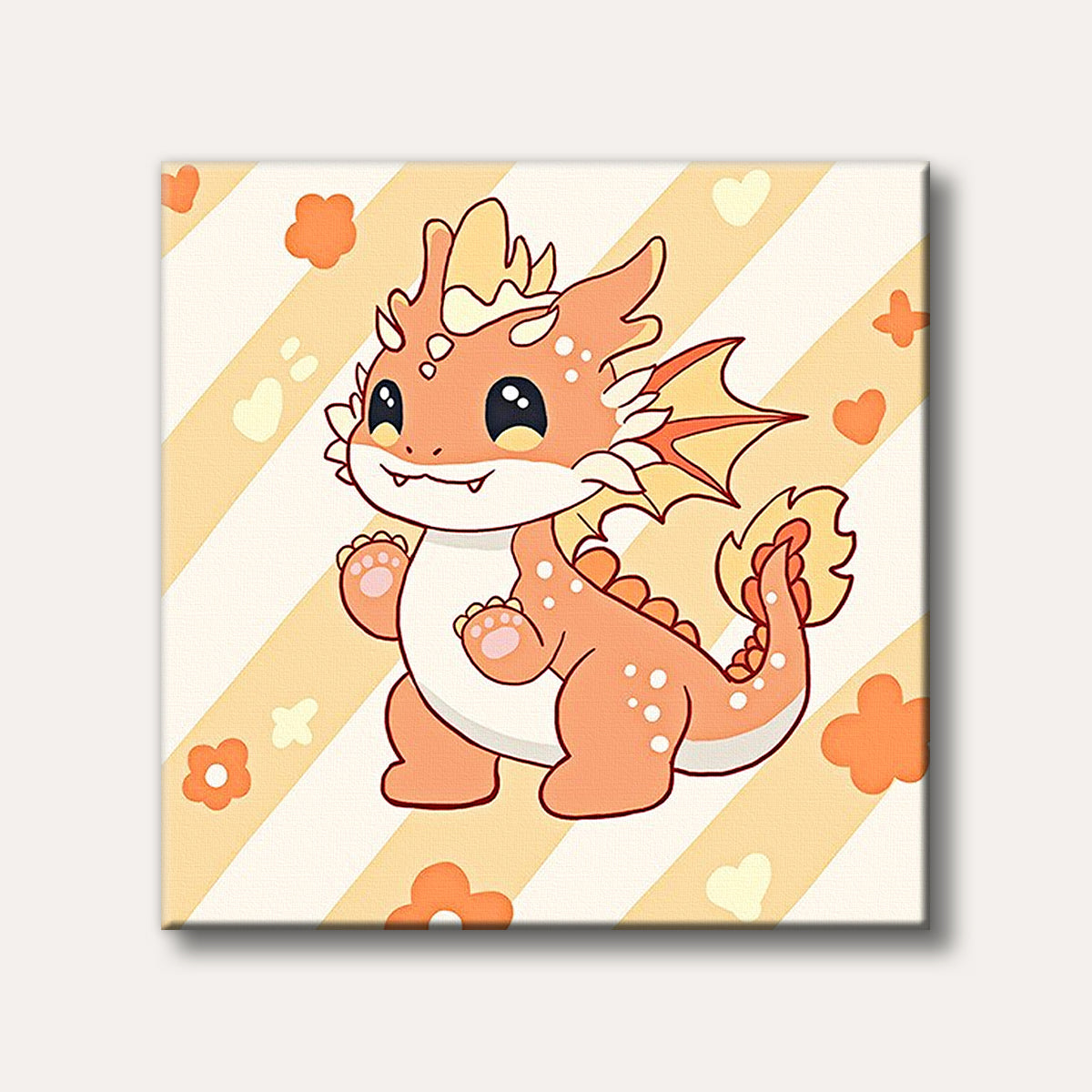 A cute orange and yellow cartoon baby dragon with big eyes and small fangs stands smiling against a pastel striped background with small heart and flower shapes, rendered in a cheerful kawaii style.