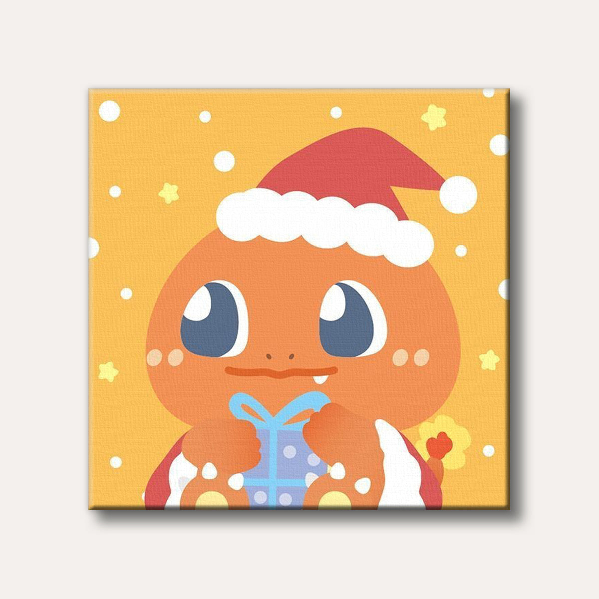 A cheerful cartoon Charmander, from Pokémon, wears a Santa hat and holds a wrapped blue present, set against a festive yellow background with falling snow and stars in a cute, simple art style.