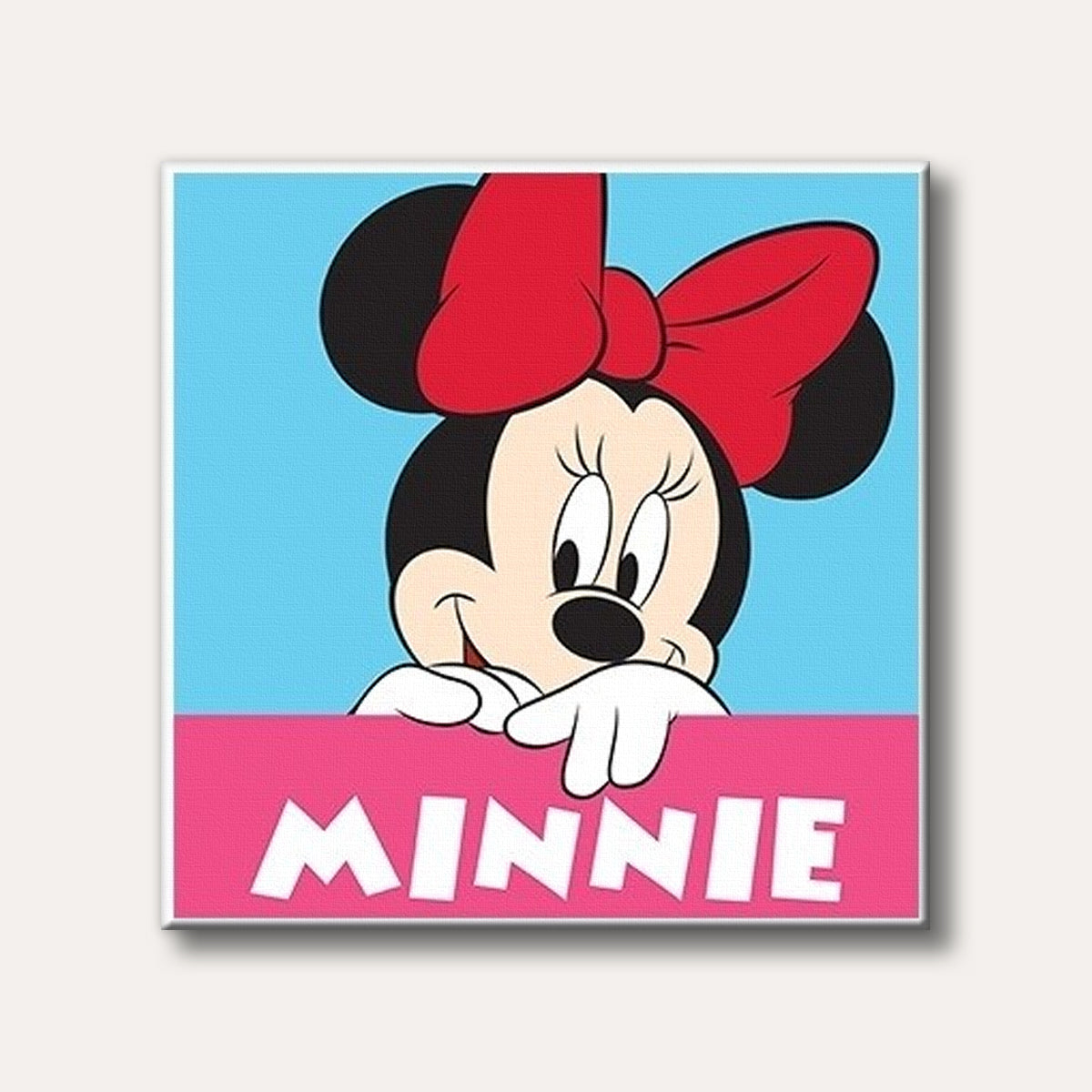 A vibrant illustration of Minnie Mouse peeking over a pink banner displaying her name, set against a bright blue background in a classic cartoon style.