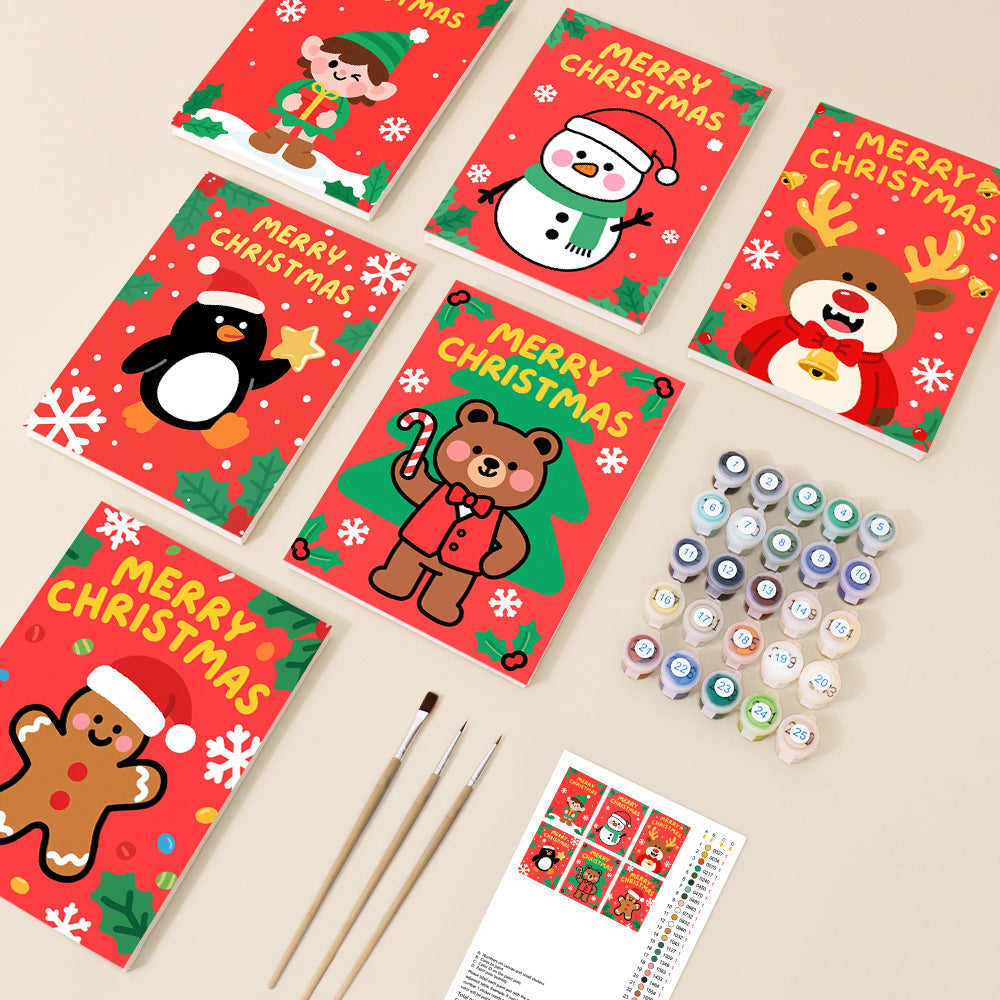 A collection of six small, vibrant Christmas-themed paint by number canvases featuring cute cartoon characters like an elf, snowman, reindeer, penguin, bear, and gingerbread man, accompanied by paints and brushes.