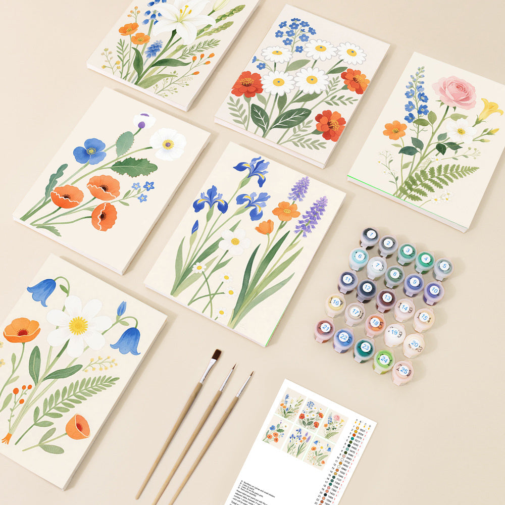 A collection of six paint by number canvases displays vibrant, illustrative floral arrangements featuring various garden flowers, complete with paints and brushes on a light background.