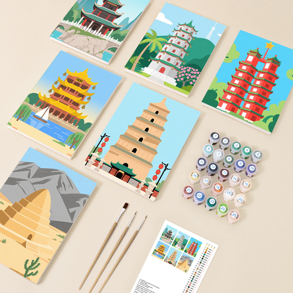 A vibrant collection of paint by number canvases displaying various East Asian pagodas and temples in a simplified, colourful art style, arranged with brushes and numbered paint pots.