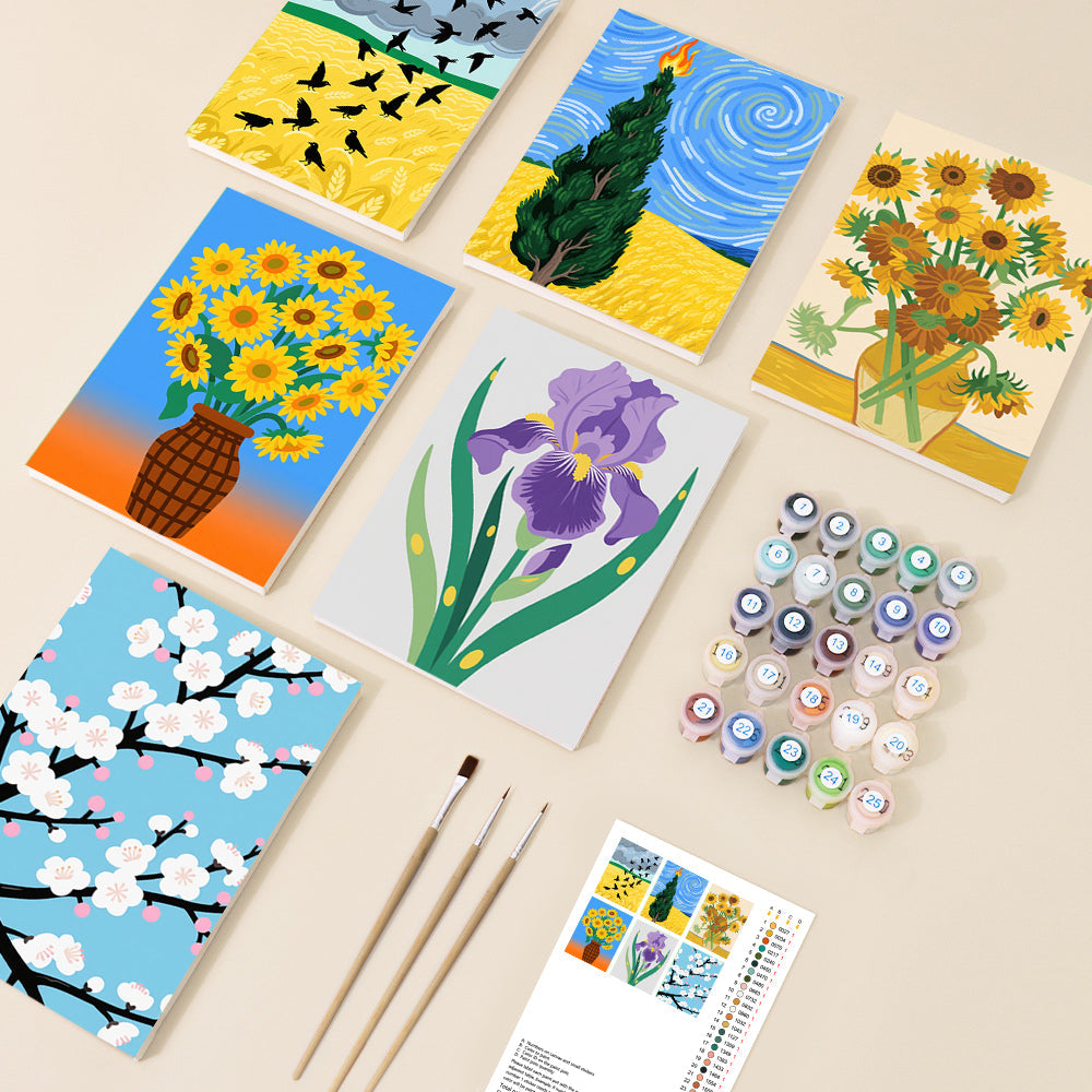 An overhead view of a diverse paint by number kit, showcasing six varied canvases including floral arrangements, a cypress tree, and birds, along with numbered paint pots and brushes, laid out on a light background.