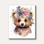 A charming watercolour illustration of a baby bear wearing a beautiful floral crown, rendered in soft, pastel tones with paint splatters.