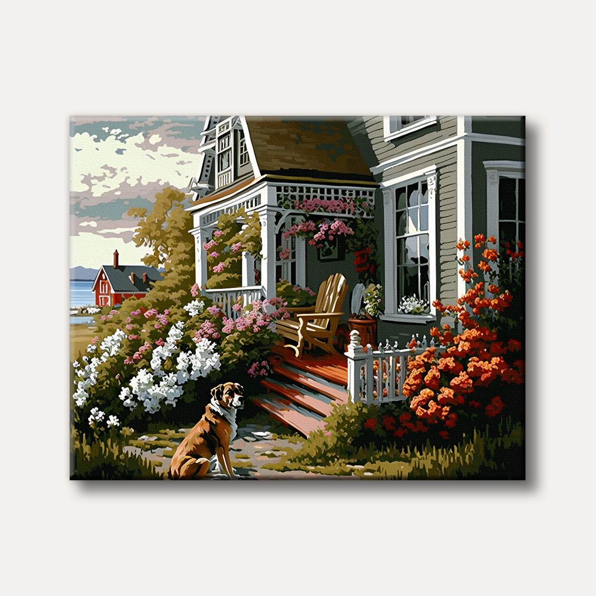A brown and white dog sits patiently in front of a charming Victorian-style cottage adorned with vibrant flowers, with a glimpse of the sea and another house in the background, depicted in a bright, inviting painterly style.