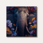 A majestic elephant's face, with large ears and tusks, is shown front and center, surrounded by a lush and colourful array of abstract flowers and leaves in shades of purple, red, orange, and blue, all against a dark background, in a highly stylized and painterly art style.