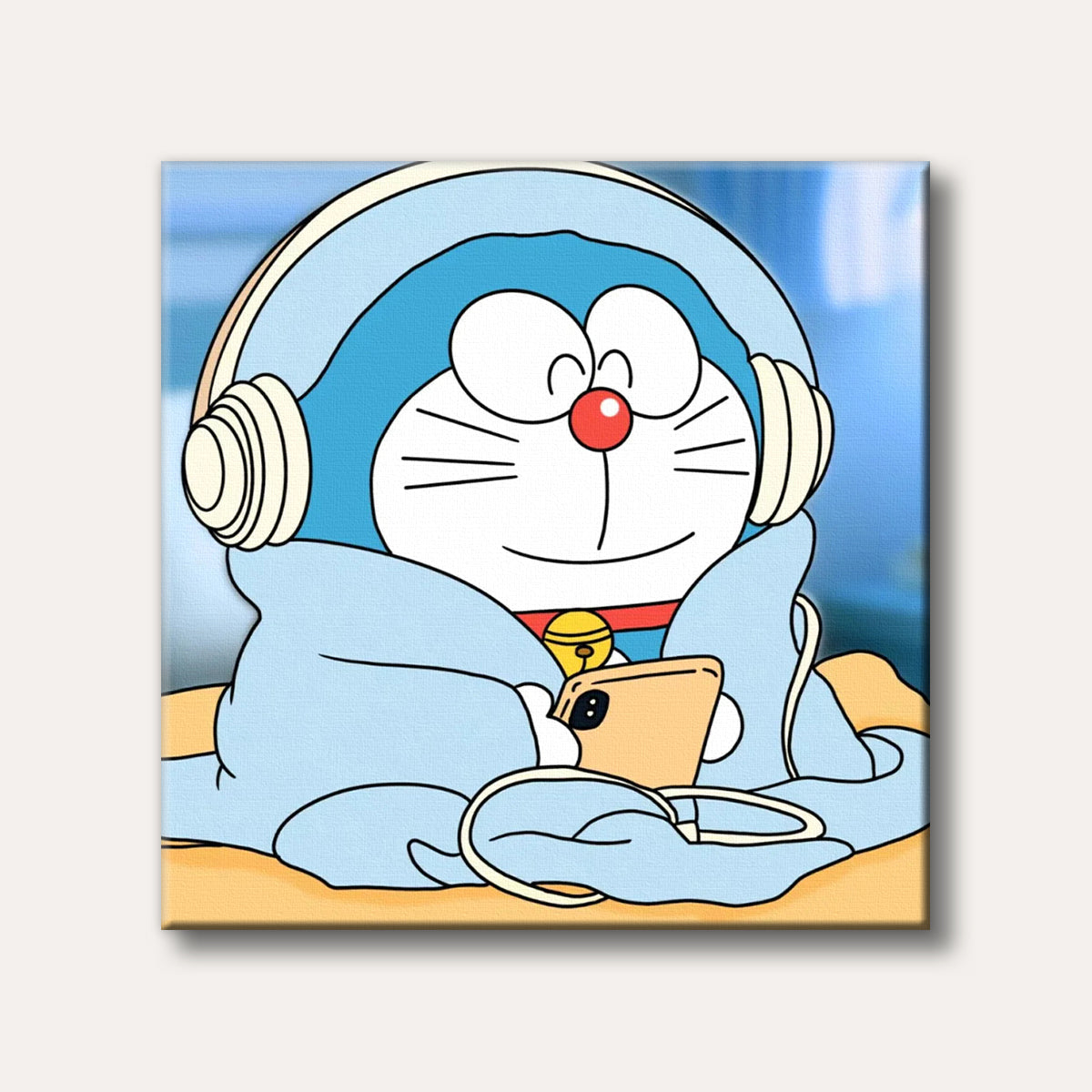 A charming cartoon image of Doraemon, the blue robot cat, smiling and wearing headphones, wrapped in a light blue blanket while holding a smartphone.