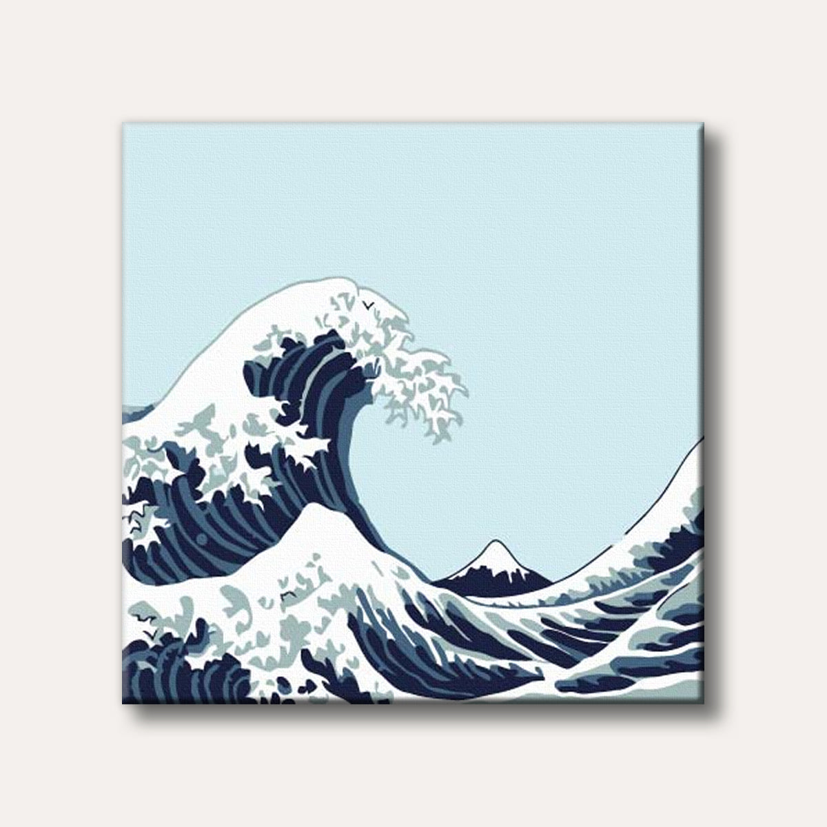 An iconic Japanese woodblock print featuring a colossal blue and white wave crashing over fishing boats, with the distant peak of Mount Fuji under a light blue sky.
