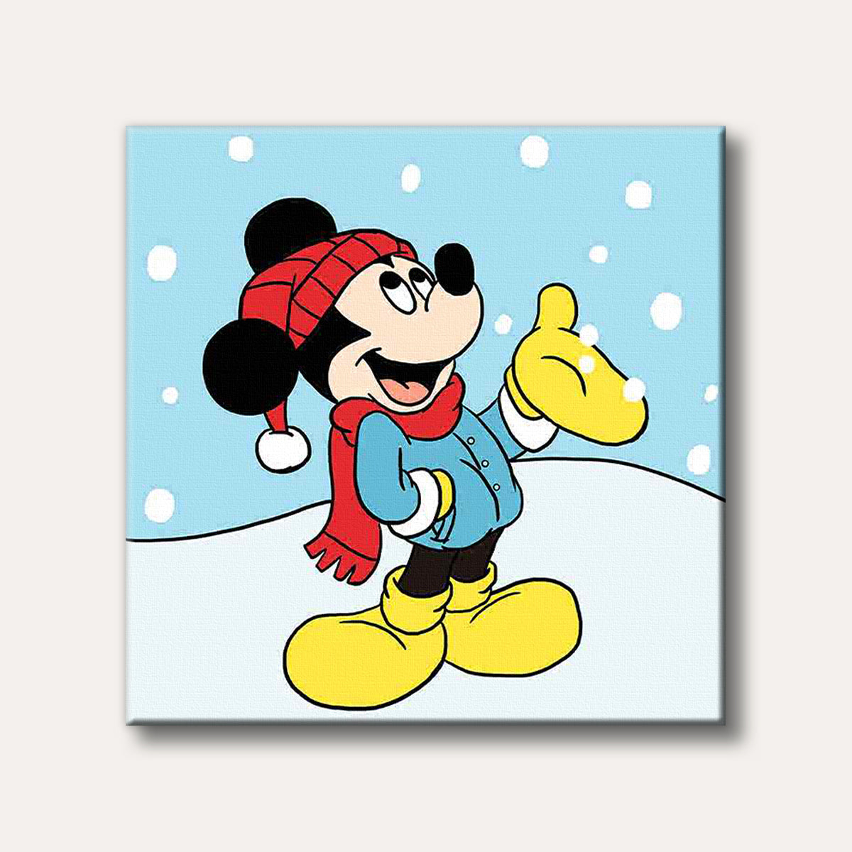 A classic cartoon image of Mickey Mouse smiling and looking up at falling snowflakes while dressed in a red hat, scarf, and yellow boots, set against a light blue winter sky.