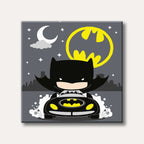 A stylized, cute illustration of Batman in his Batmobile driving at night, with the yellow Bat-signal and a white crescent moon in the dark sky.