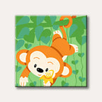 A cute, orange cartoon monkey hangs from a green vine, holding a banana, depicted in a cheerful and simple illustration style.
