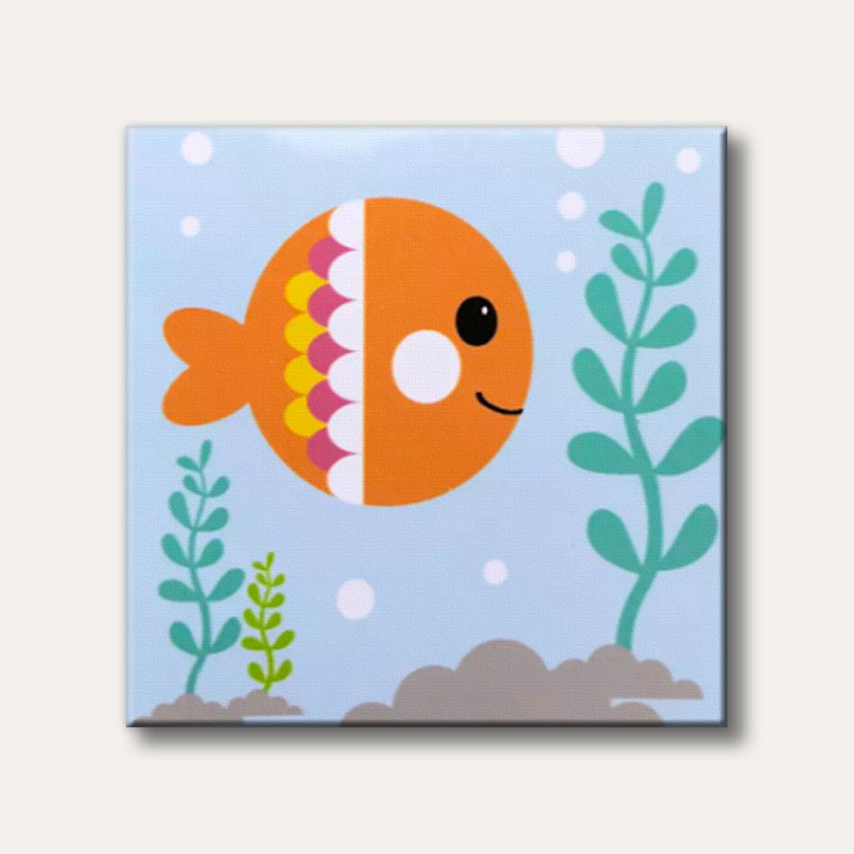 A cheerful orange cartoon goldfish with pink and yellow scales swims in light blue water with green plants, depicted in a simple, happy style.