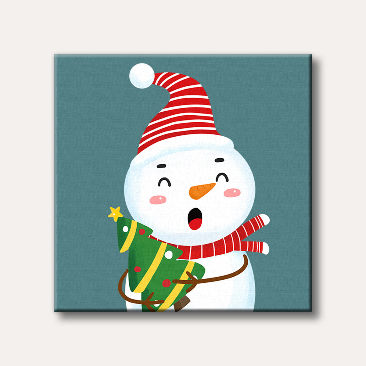 A cute, cartoon-style snowman wearing a red and white striped hat and scarf, holding a small decorated Christmas tree, with a cheerful expression on a solid teal background.