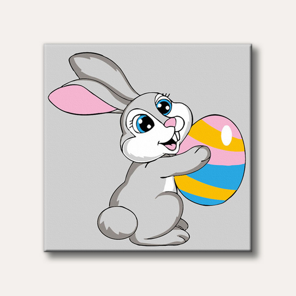 A cute cartoon grey bunny rabbit with blue eyes holding a colourful striped Easter egg, depicted in a cheerful and playful style.