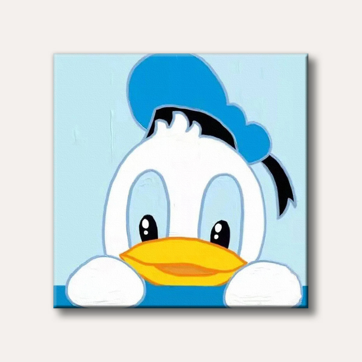 A cute, stylized portrait of Donald Duck peeking from the bottom of the frame, featuring his white head, blue sailor hat, and yellow bill, against a light blue background.