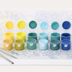 acrylic paint open and brushes on paint by numbers canvas