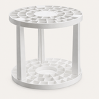 Plastic Brush Holder on warm off-white background